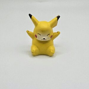 Vintage 1999 TOMY / CGTSJ Pokémon Pikachu 2-Inch Mini Figure (Seated / Eyes Closed Sleeping Pose)