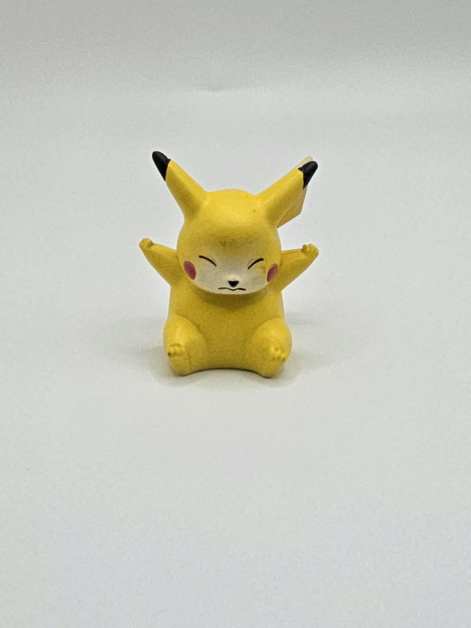 Vintage 1999 TOMY / CGTSJ Pokémon Pikachu 2-Inch Mini Figure (Seated / Eyes Closed Sleeping Pose)